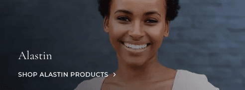 Smiling woman promoting Alastin products